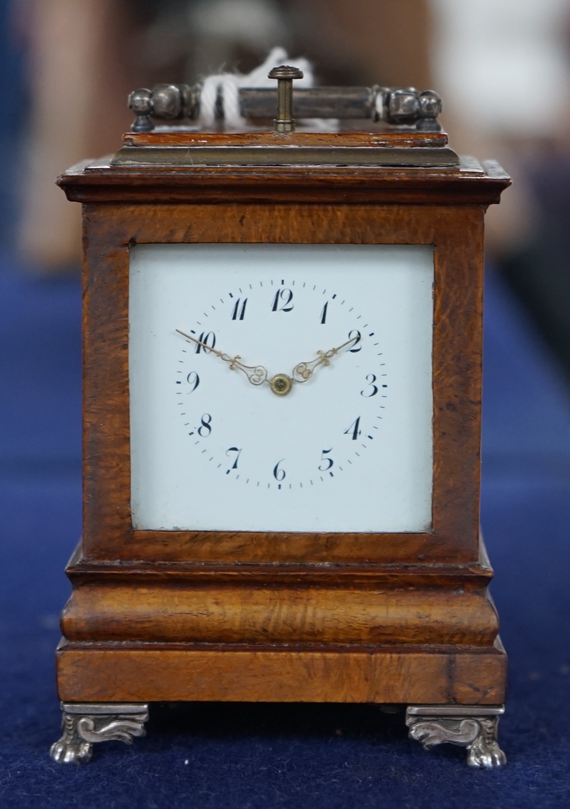 An early 20th century walnut miniature repeating carriage clock, with key, 8.5cm. Condition - fair, currently ticking